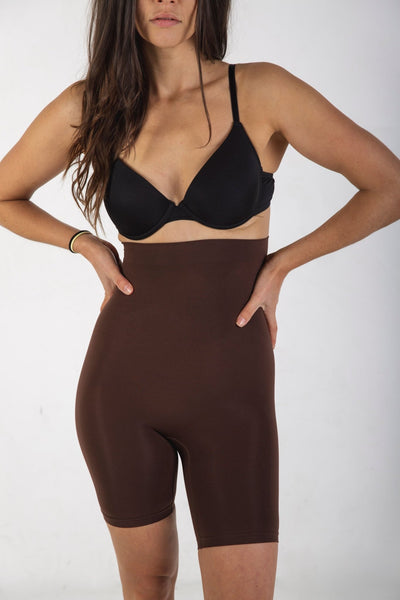 How does shapewear give the appearance of a slimmer figure?